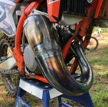 Installed 2-stroke pipe on a dirt bike